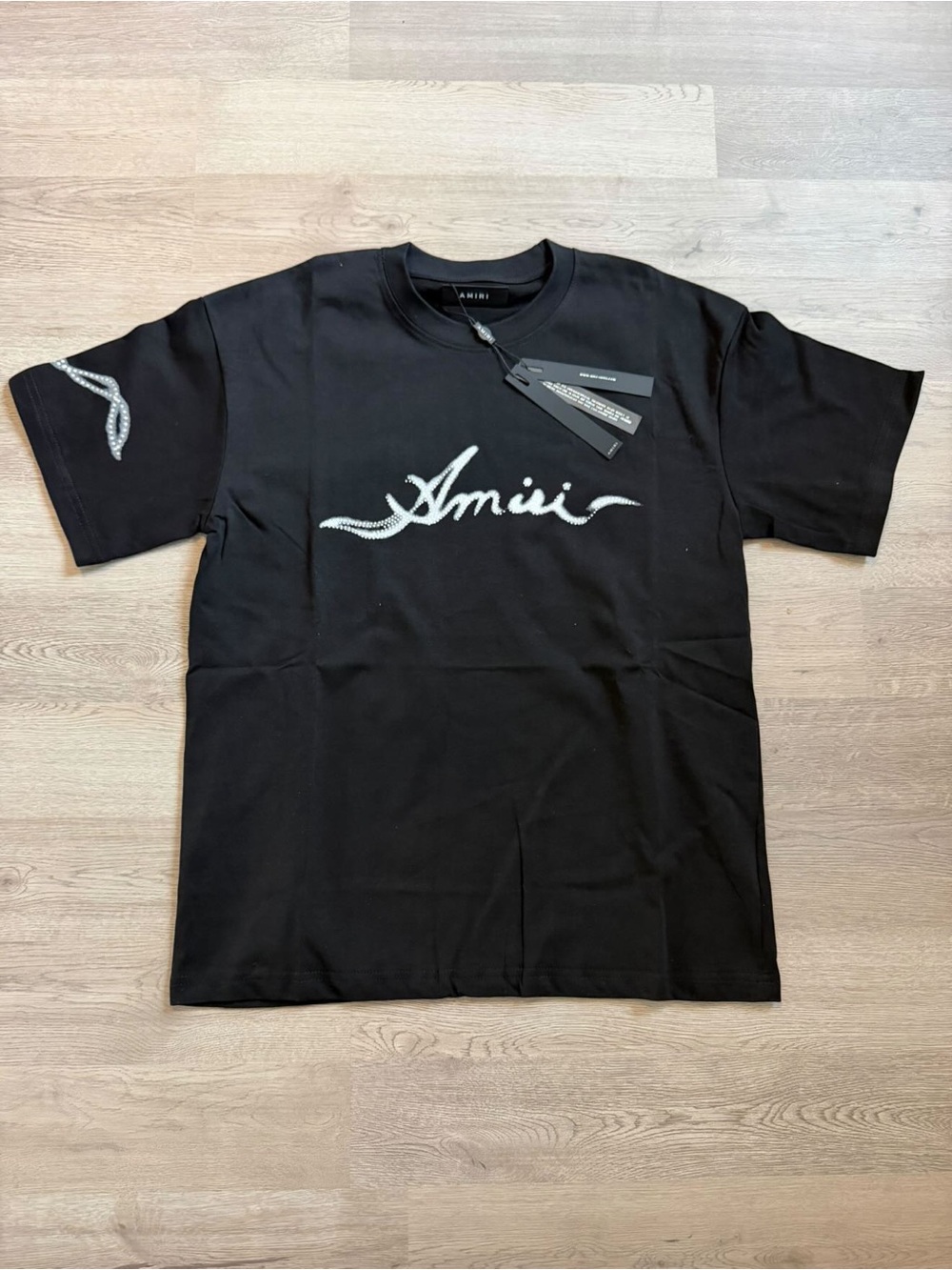 AMIRI Black Tee with White Script Logo and Sleeve Detail